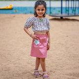 A girl wearing Block print cotton crop top and peach skirt with flowers